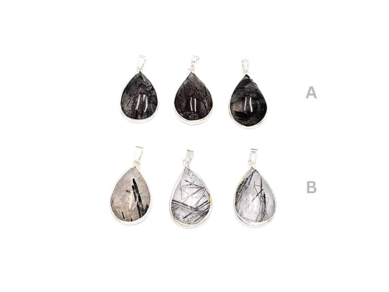Pandant din Cuart cu Turmalina Neagra, forma de cabochon lacrima de aprox. 3 x 2 cm si accesorii metalice, provenienta India.