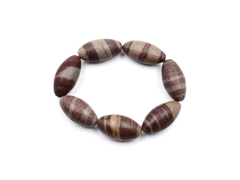 Fiecare Bratara Shiva Lingam contine 7 pietre de aproximativ 3 cm. Marime bratara M- aprox. 18-19 cm